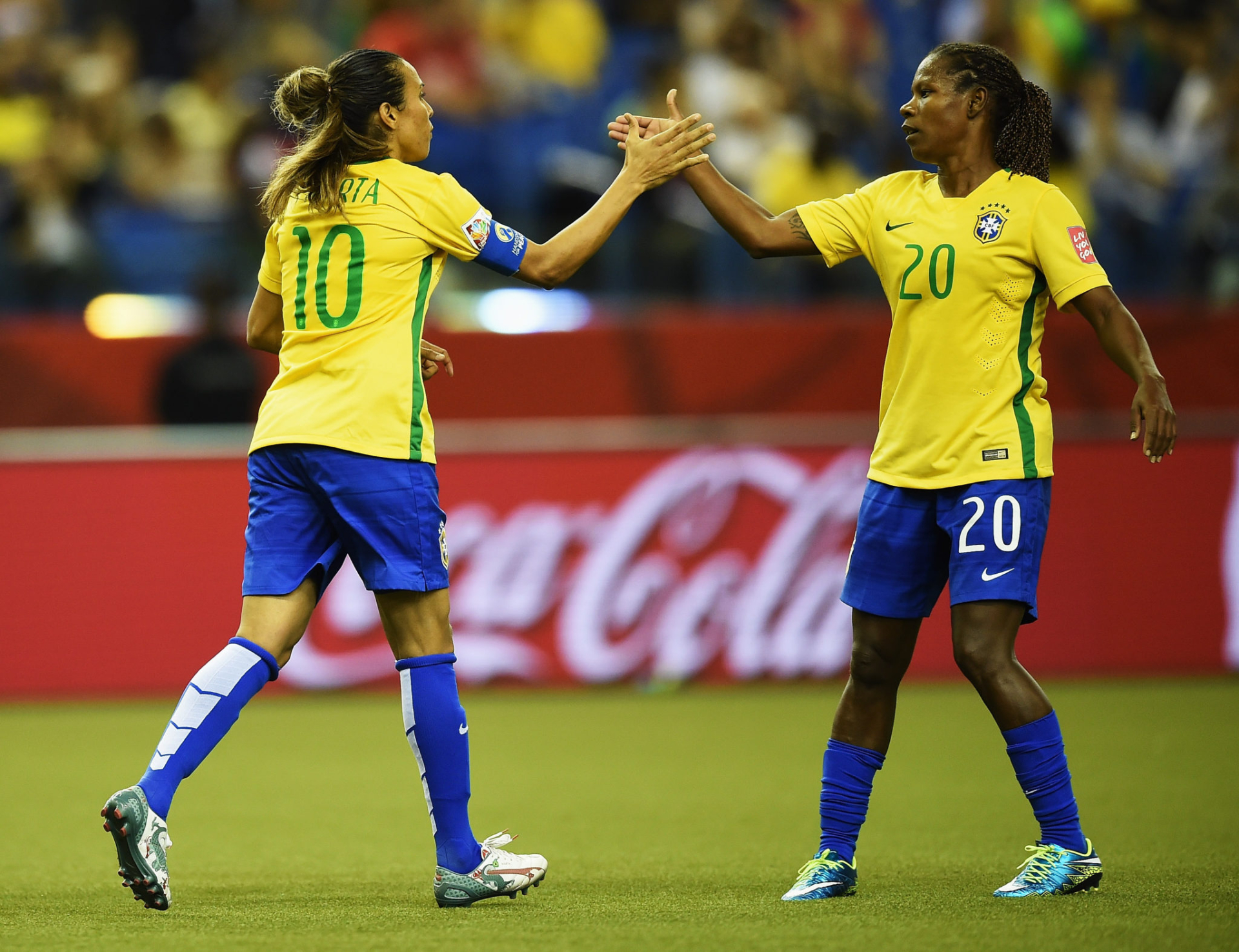 MONTREAL, QC - JUNE 09:  Marta of Brazil celebrates scoring her penalty goal with Formiga during the FIFA Women's World Cup 2015  group E match between Brazil and Korea Republic at Olympic Stadium on June 9, 2015 in Montreal, Canada  (Photo by Stuart Franklin - FIFA/FIFA via Getty Images)