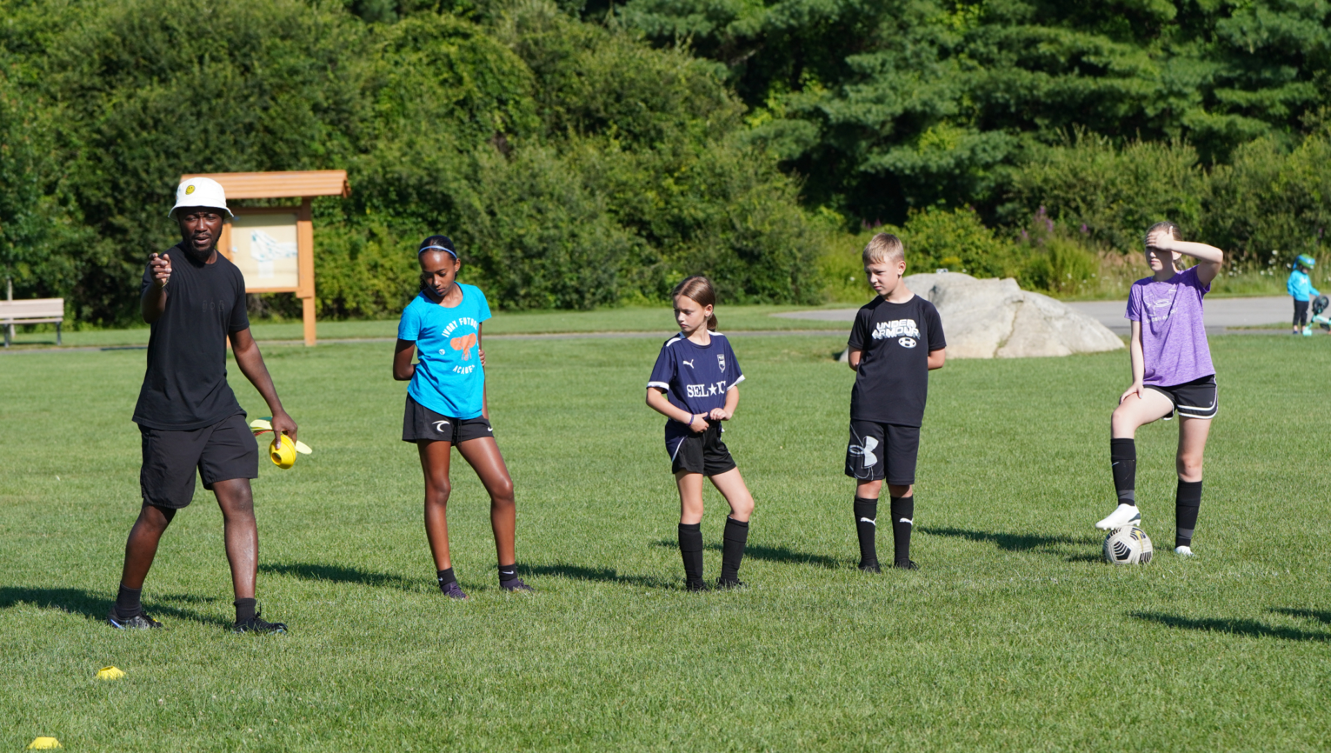 Coach Charles at Ivory Futbol Academy summer skills clinics, camp